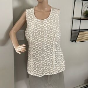 Tan lace front sleeveless shirt.